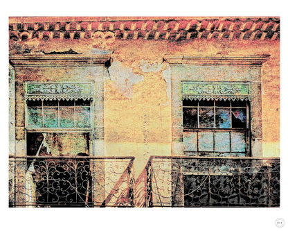 Close-up of weathered building with two ornate ironwork balconies and peeling paint. Fine art photography by RLF Photography